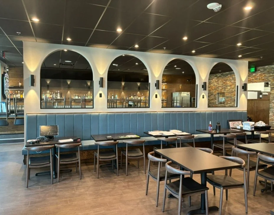 19th Hole Bar and Grill interior with arched wall features and custom seating